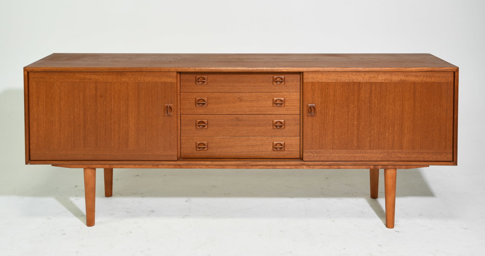 Mid Century Modern Sideboard Attrib. Clausen: Danish Modern Style Sliding Door Sideboard with Four Central Drawers Attributed to Clausen - 31.5 in tall x 82.25 x 18