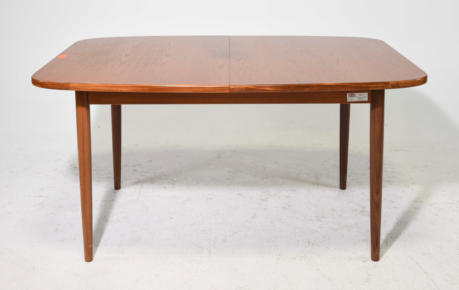 Mid Century Oval Dining Table by G-Plan: This Danish Modern Style Oval dining table with four leg base is made by Mid Century Modern Furniture Maker G Plan ( Gplan ), it has a pop out leaf - 28 in tall x 56 x 39, leaf us 18 in - floor to