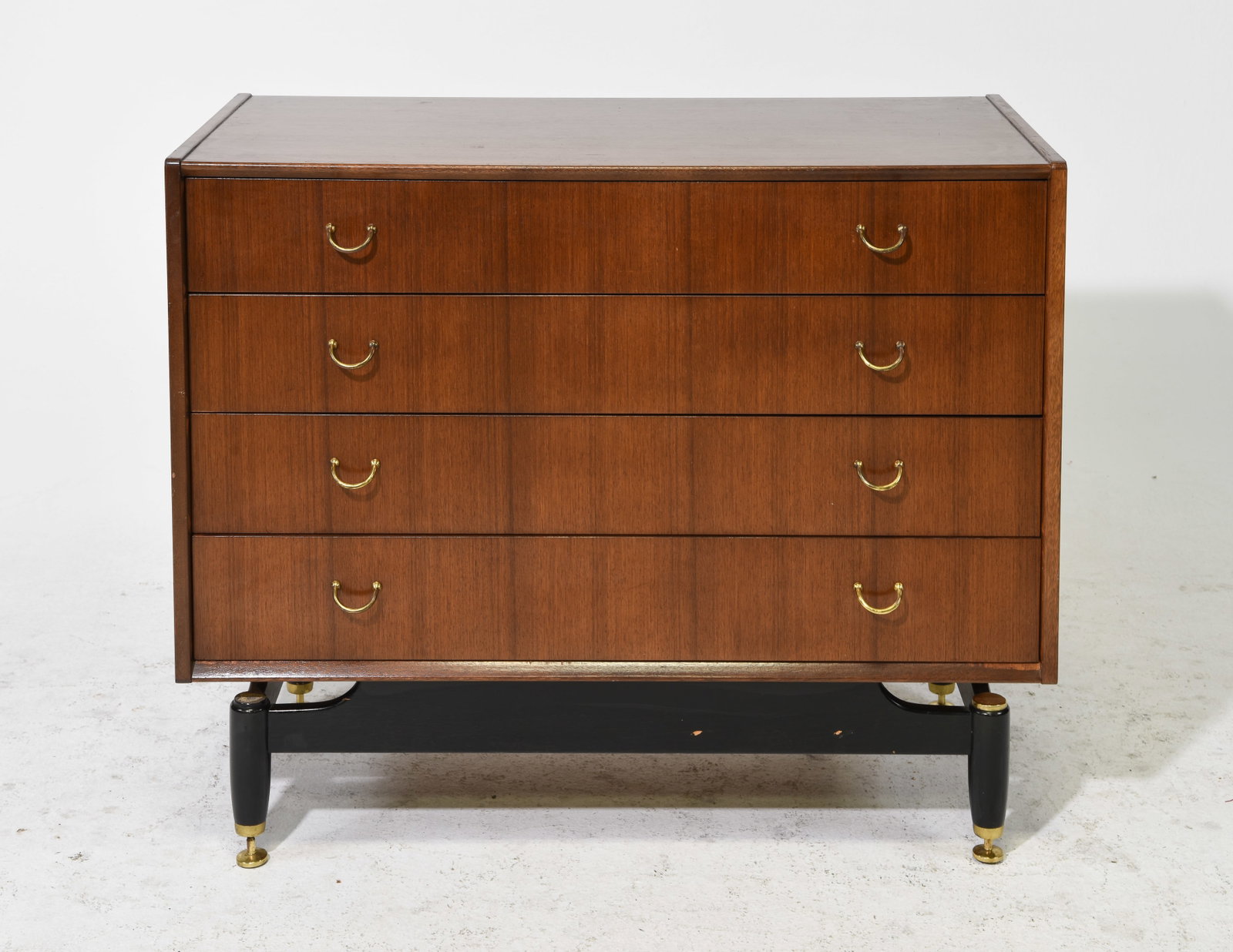 G-Plan Black and Tola Mid Century Modern Chest #1: This Danish Modern Style tall chest is made in England by G Plan, it is made from tola wood and features 4 drawer with brass hardware and a black base with adjustable feet. Gplan is well known in the