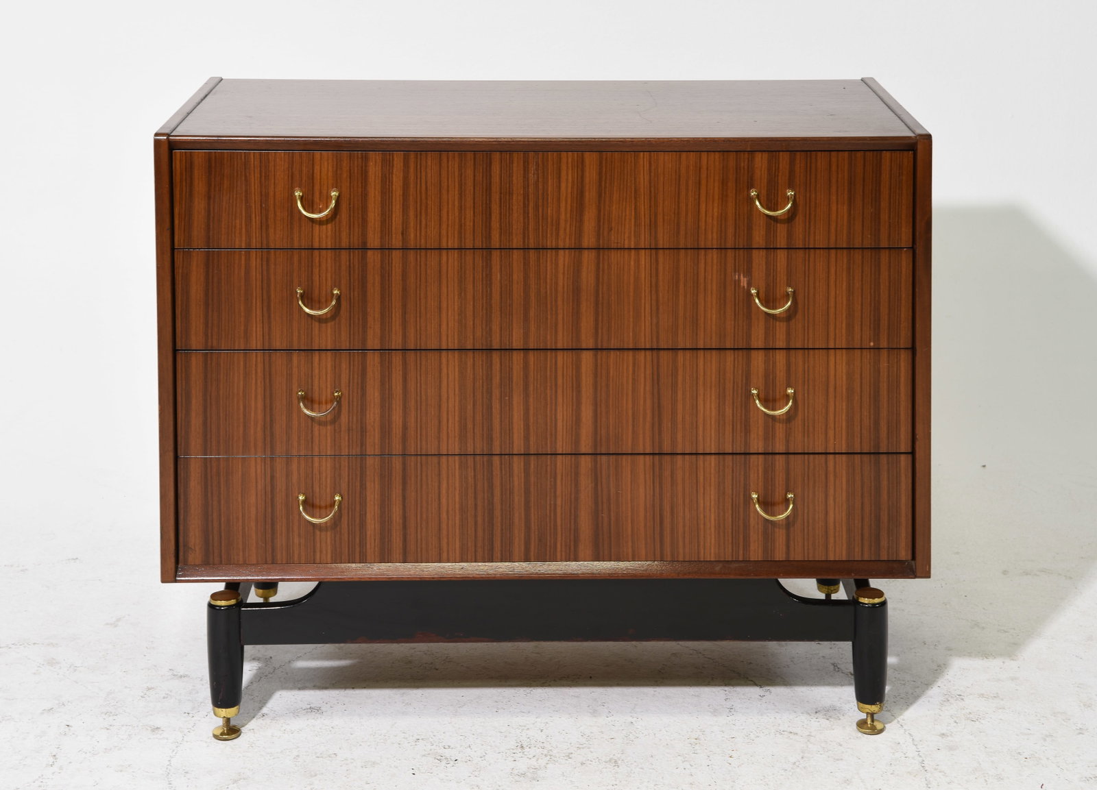 G-Plan Black and Tola Mid Century Modern Chest #3: This Danish Modern Style tall chest is made in England by G Plan, it is made from tola wood and features 4 drawer with brass hardware and a black base with adjustable feet. Gplan is well known in the