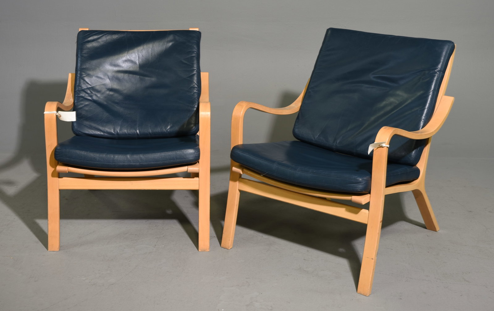 Danish Pair of Navy Leather Upholstered Arm Chairs: Danish Pair of Navy Leather Upholstered Arm Chairs - 31.5 in tall x 26 x 29 each with a seat height of 16 inches