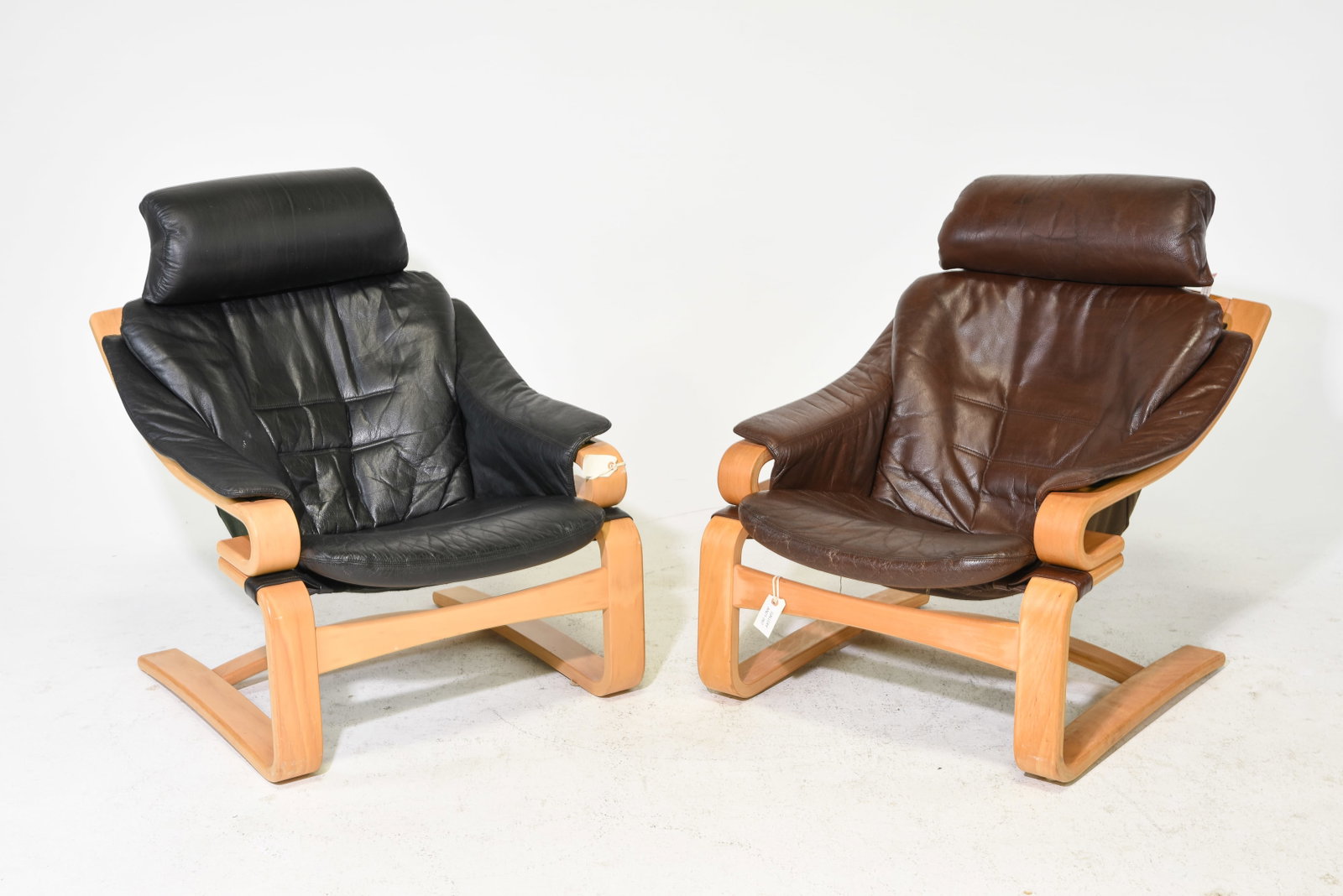 2 Danish Modern Leather Cantilever Lounge Chairs: 2 Danish Modern Leather Cantilever Lounge Chairs - 37.5 in tall x 30 x 37 with a seat height of 15 inches and 36 in tall x 29.5 x 36 with a seat height of 15 inches