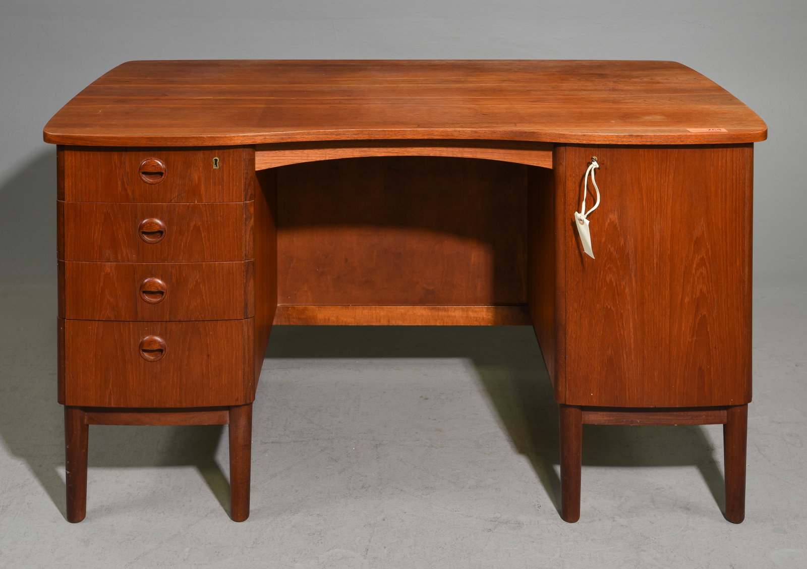 Danish Modern Desk with Bookshelf Front: Danish Modern Desk with Bookshelf Front - 29.25 om tall x 52 x 28, Kneehole is 27 inches from the floor to under by 21.5 inches wide