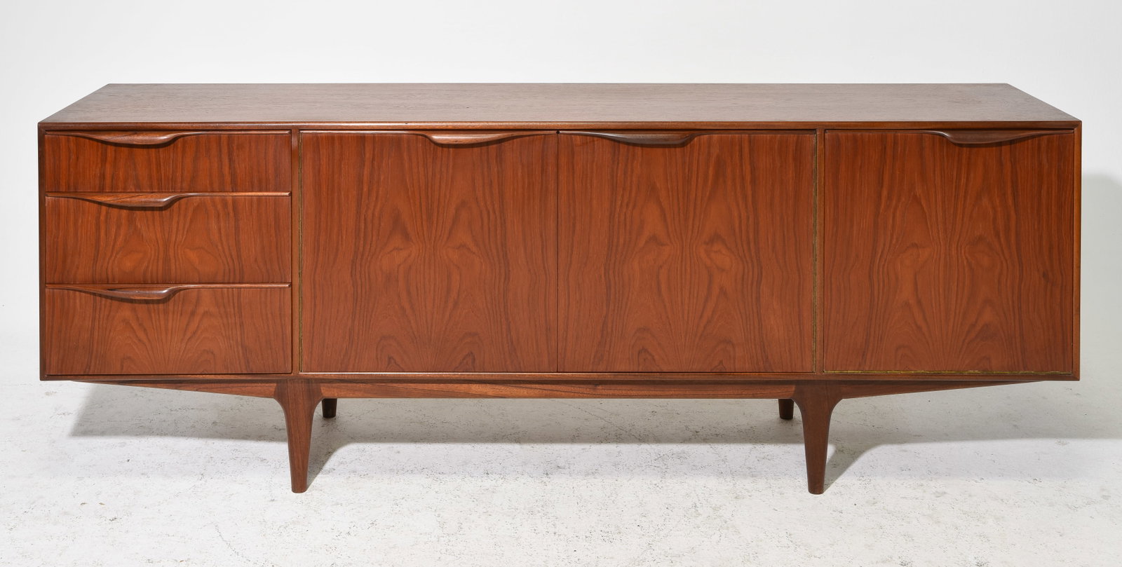 Mid Century Sideboard - Mcintosh - "Dunvegan": This Danish Modern Style Teak Credenza / Cocktail Sideboard with folded handles & pull out tray is made by Scottish Mid Century Modern Furniture Maker McIntosh. It was designed by Tom Robertson, it is