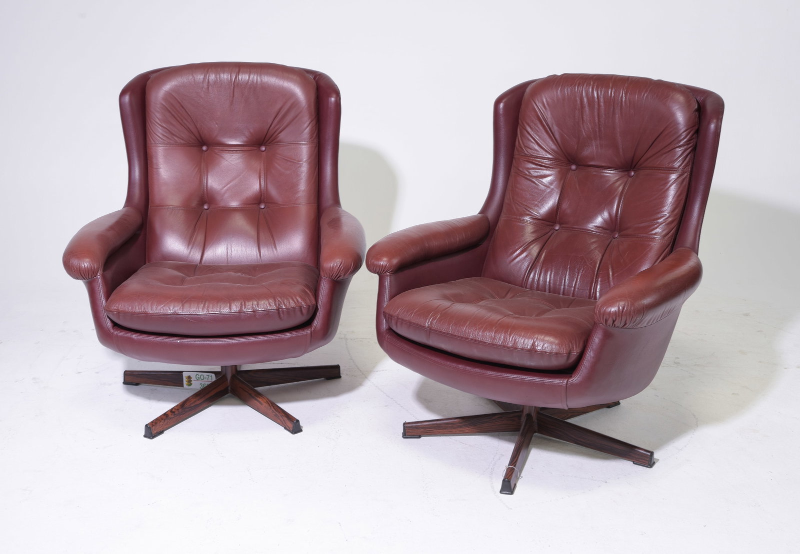 Mid Century Modern Pair of Leather Swivel Chairs: Danish Modern Style Pair of Leather Tufted Back Swivel Lounge Chairs - 36 in tall x 32 x 34 each with a seat height 17 inches