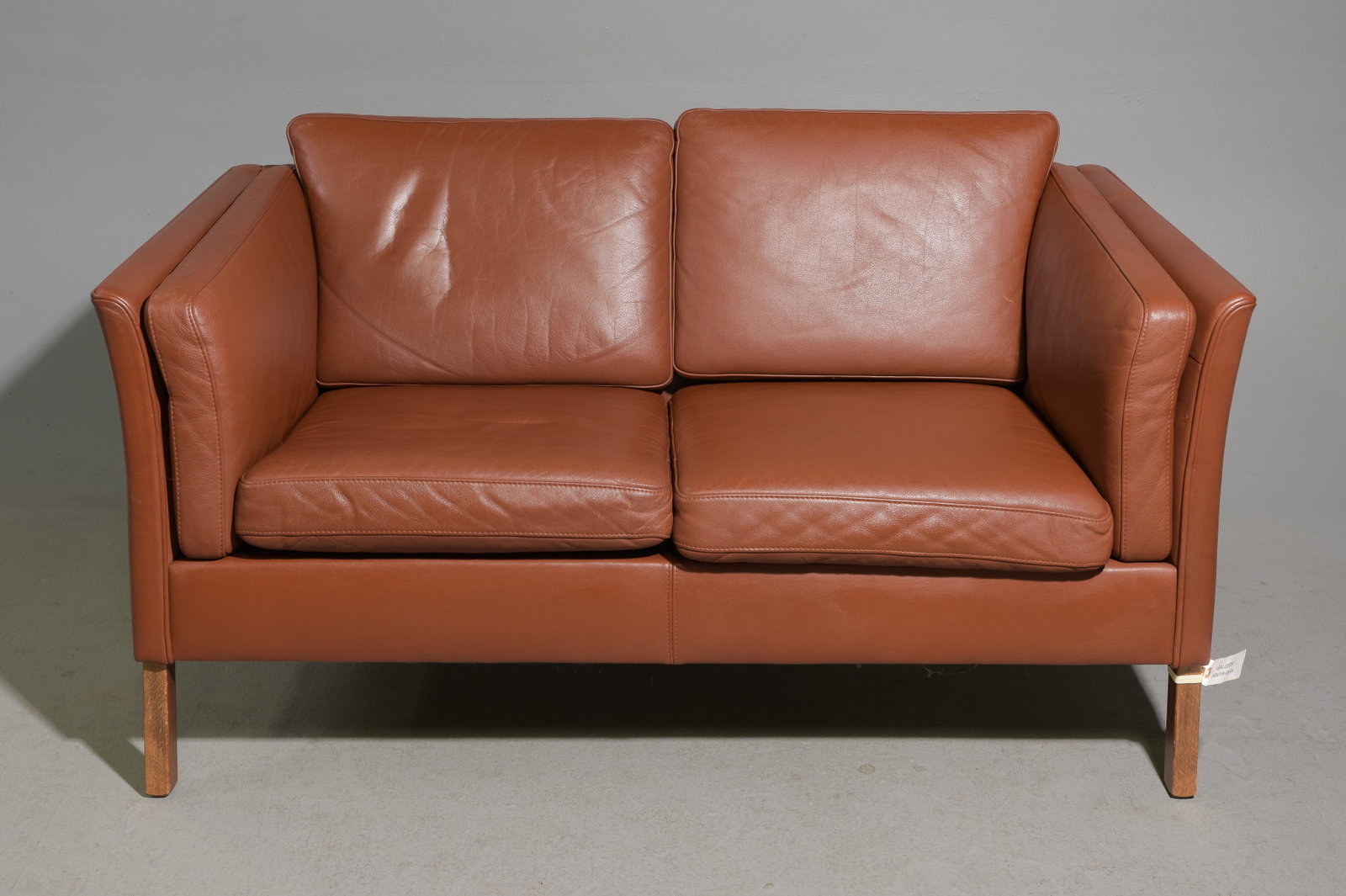 Danish Modern Leather Two Seater Sofa: Danish Mid Century Modern Leather Two Seater Sofa / Loveseat - 29.5 in tall x 56.25 x 31.25 with a seat height of 17 inches