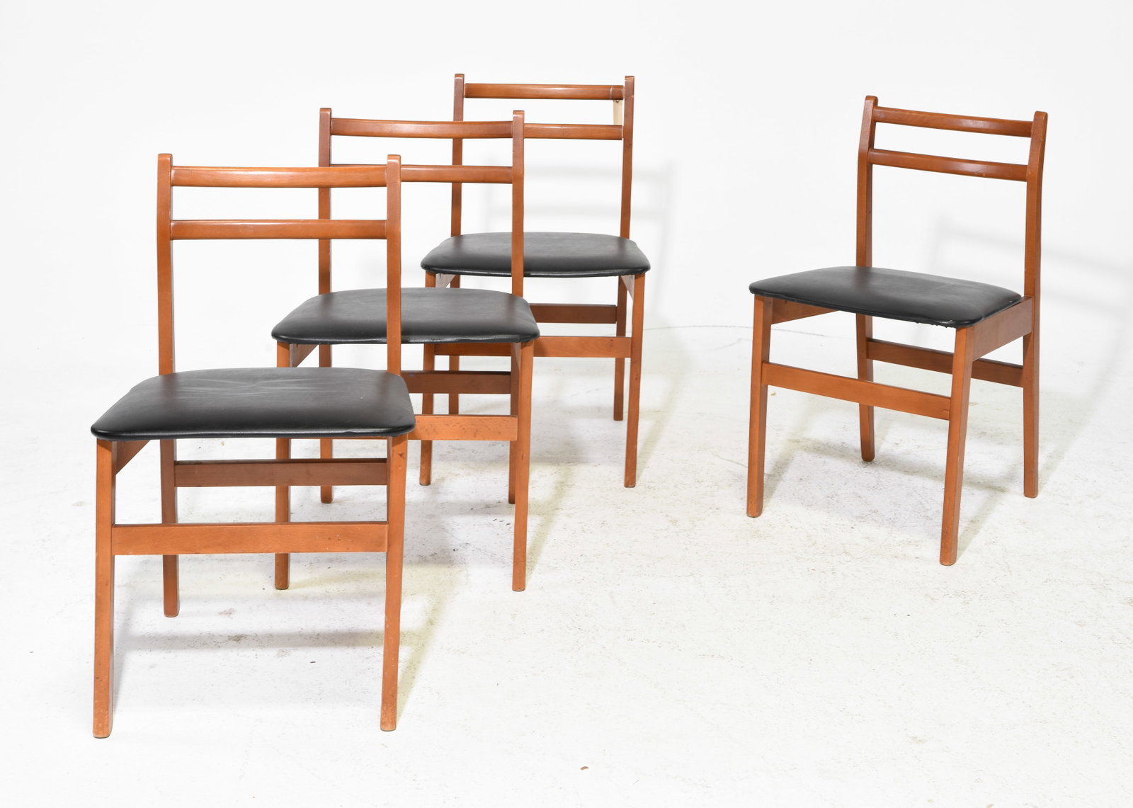 Mid Century Modern Set of 4 Dining Chairs: Danish Modern Style Set of 4 Dining Chairs with Black Vinyl Upholstery - 29.5 in tall x 17.5 x 17 each with a seat height of 17.25 inches