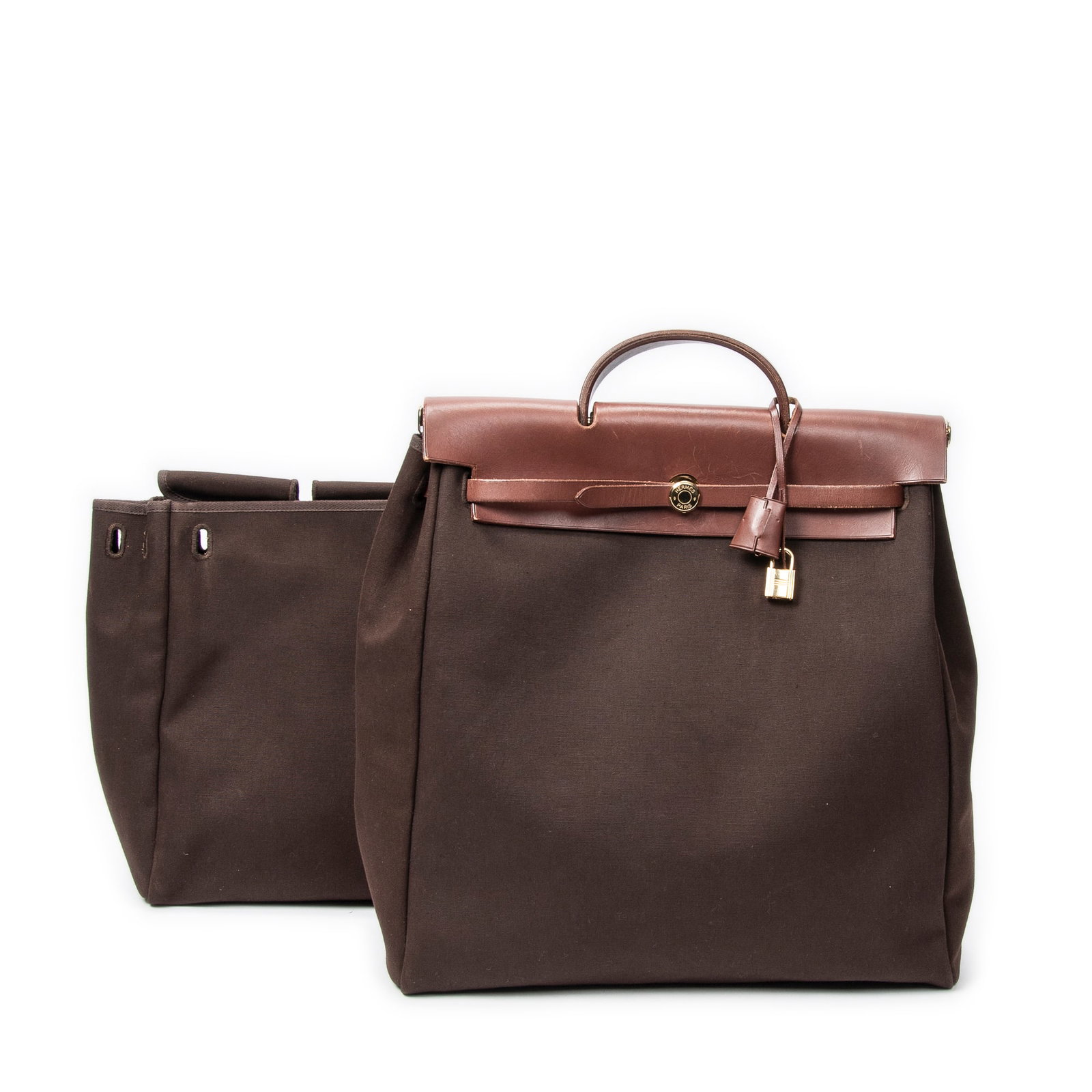 Hermes Herbag 2in1 GM in Brown Toile Officier Canvas: Genuine Pre-Owned Hermes Herbag 2in1 GM in Brown Toile Officier Canvas made in France in AB condition. Date Code is Stamp P in Square (2012) Measurements: 38*33*14cm (Length * Height * Width). This lo