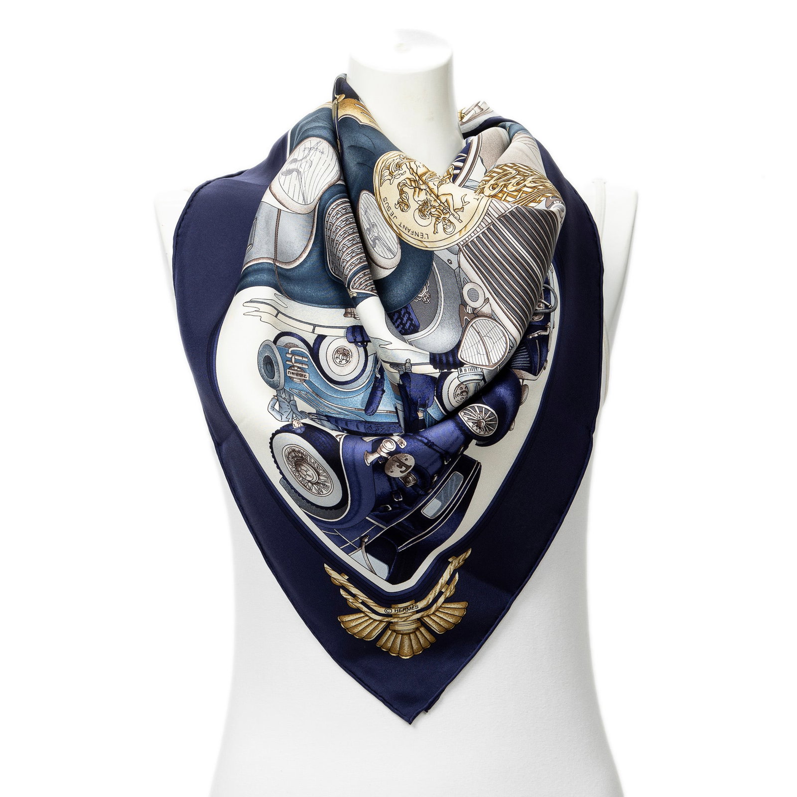 Hermes Scarf- Automobile by Joachim Metz: Genuine Pre-Owned Hermes Scarf in Navy/Gold/Ivory 100% Twill Silk in AA condition. Pattern / Title is Automobile by Joachim Metz Measurements: 90*90cm (Length * Height * Width). This lot includes a ce