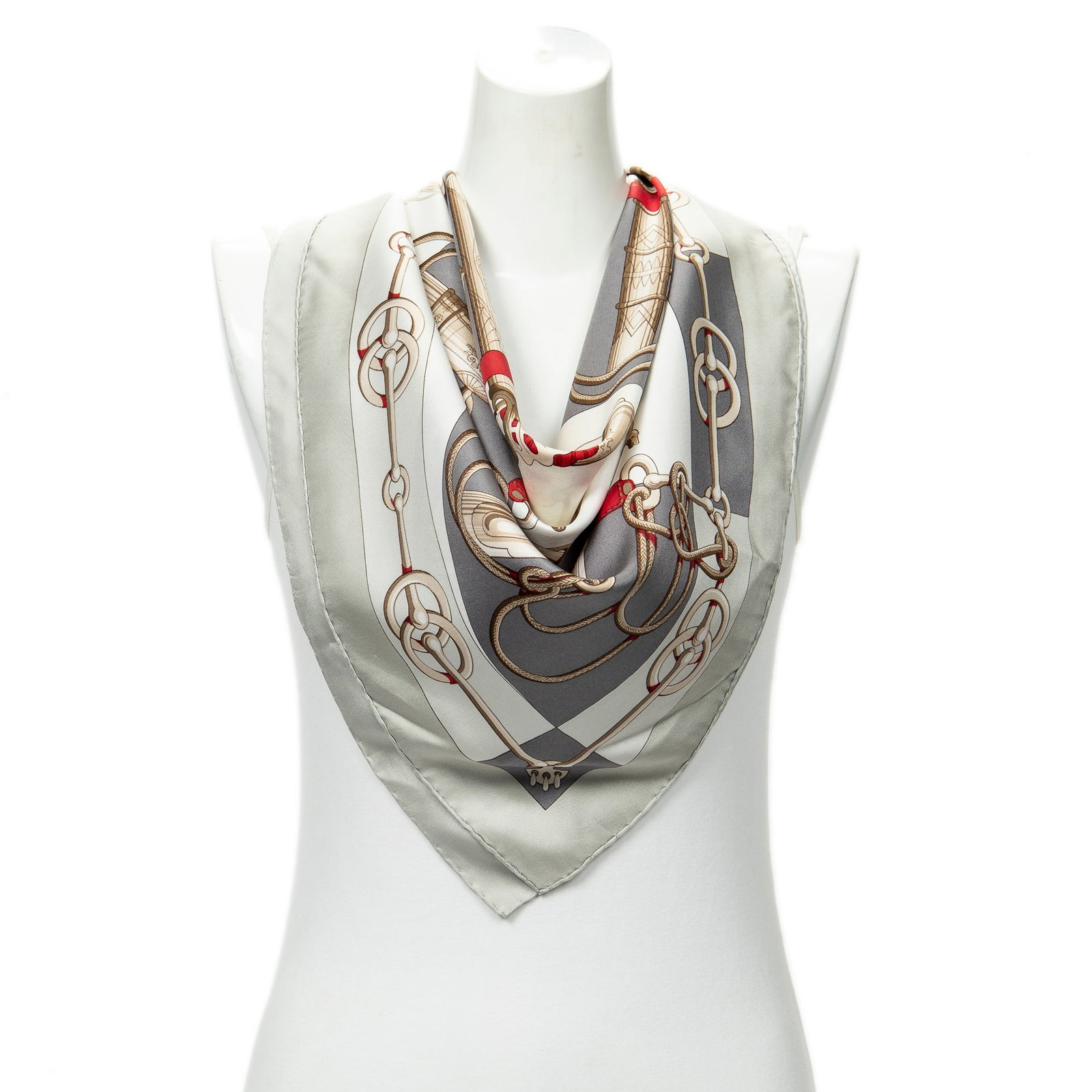 Hermes Scarf- Cliquetis by Julia Abadie: Genuine Pre-Owned Hermes Scarf in Beige/Grey/Brown 100% Twill Silk in AB condition. Pattern / Title is Cliquetis by Julia Abadie Measurements: 90*90*0cm (Length * Height * Width). This lot includes a 