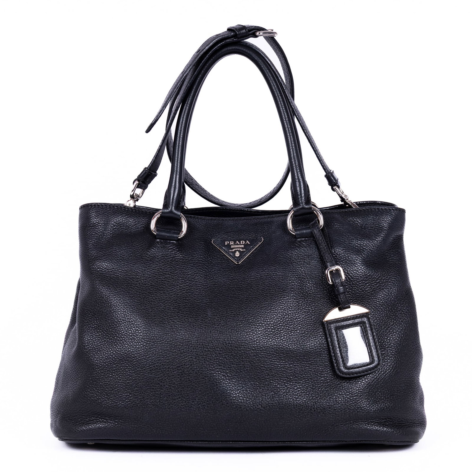 Prada Convertible Tote Medium in Black Vitello Daino: Genuine Pre-Owned Prada Convertible Tote Medium in Black Vitello Daino Leather made in Italy in A condition. Date Code is 1BA579 Measurements: 34*23*16cm (Length * Height * Width). This lot includes a