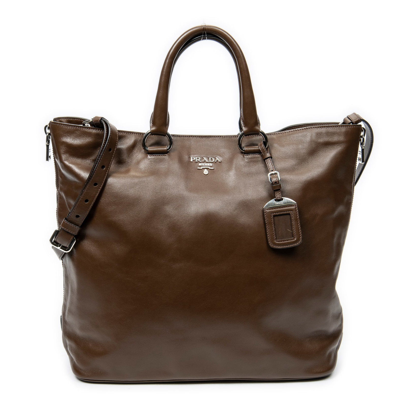 Prada Large Side Zip Tote in Brown Calfskin Leather: Genuine Pre-Owned Prada Large Side Zip Tote in Brown Calfskin Leather made in Italy in A condition. Date Code is 204 Measurements: 36*35*16cm (Length * Height * Width). This lot includes a certificate
