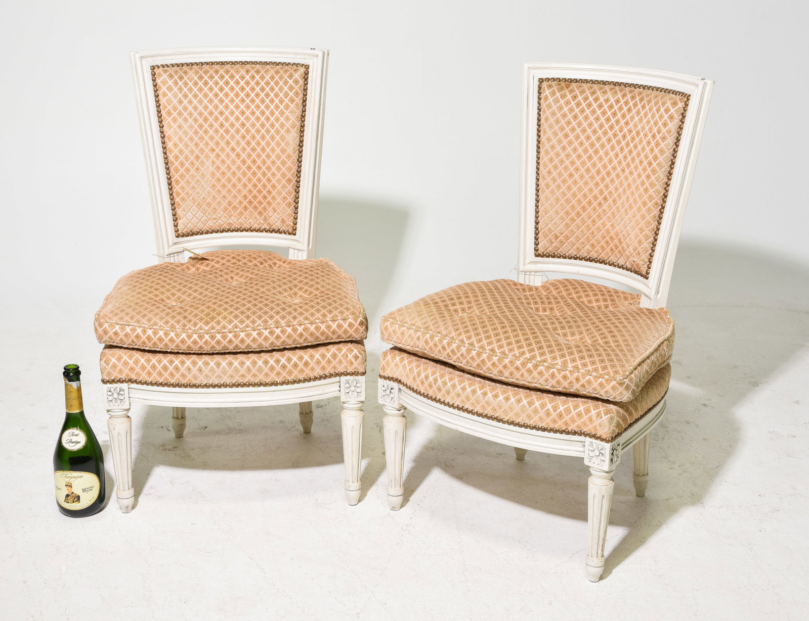 Louis XVI Style Pair of Low Painted Chairs: French Louis XVI Style Pair of "Youth" Low Painted Chairs - 33 in tall x 22 x 19 each with a seat height of 16 inches