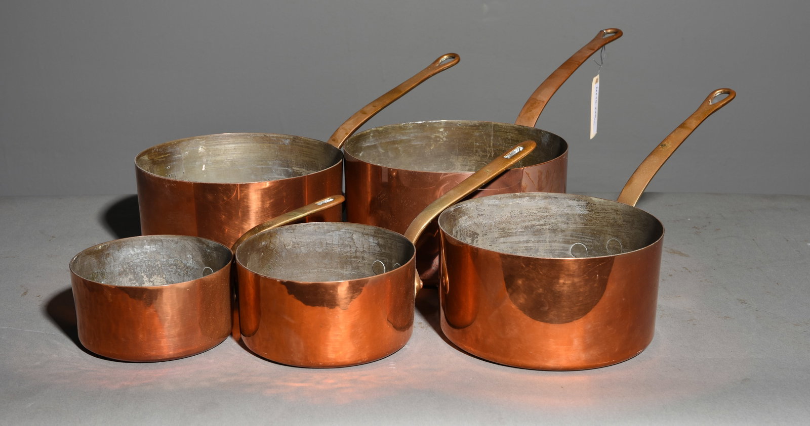 French Set of 5 Large Graduated Copper Sauce Pans: French Set of 5 Large Graduated Copper Sauce Pans with Brass Handles - Largest is 5 in tall x 19 x 9.5 - height measurement does not include the handle