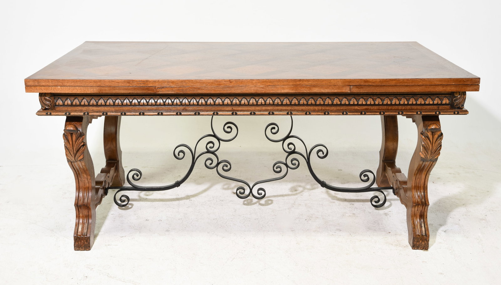 Renaissance Style Carved Oak Draw Leaf Table: French Renaissance Style Carved Oak Draw Leaf Table with Iron Stretcher - 30 in tall x 65 x 39, Leaves add an additional 19.5 inches each, Foor to apron is 24 inches and the space between the legs is