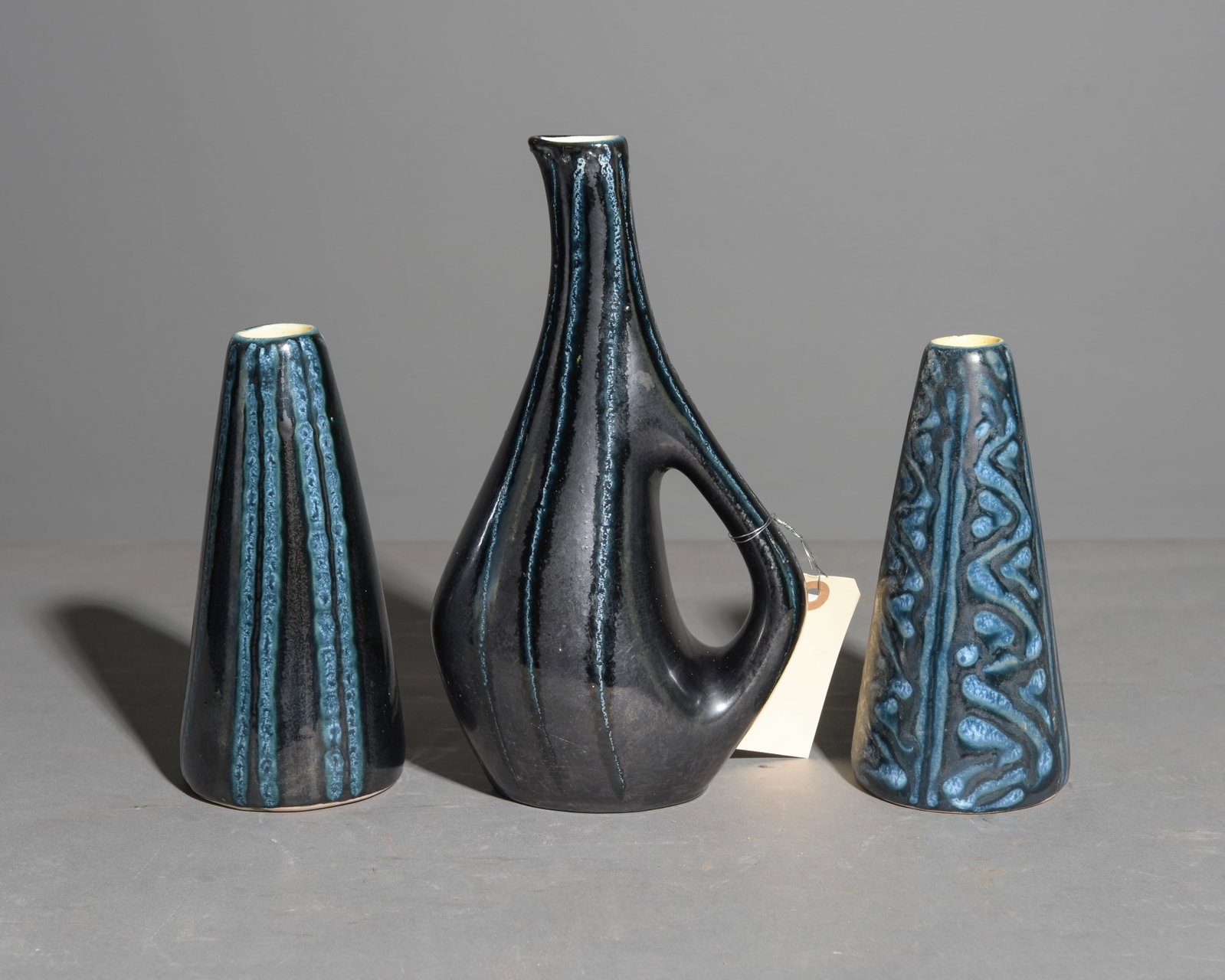 3 Vintage Hungarian Ceramic Vases - Tofej: 3 Vintage Hungarian Ceramic Vases from Tofej Pottery - This lot consists of two cone vases featuring a semi-metallic cobalt blue & dark gray/black relief pattern and one pitcher vase all produced by T