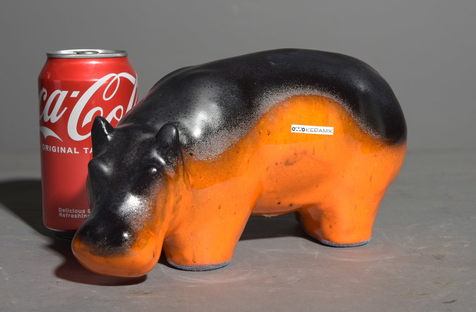 Otto Keramk Ceramic Hippo: Otto Keramk Ceramic Hippo - This features a matte black finish of a glossy vibrant orange base. These highly collectable German figures were originally designed in 1964 by the famous designer Kurt Tsc