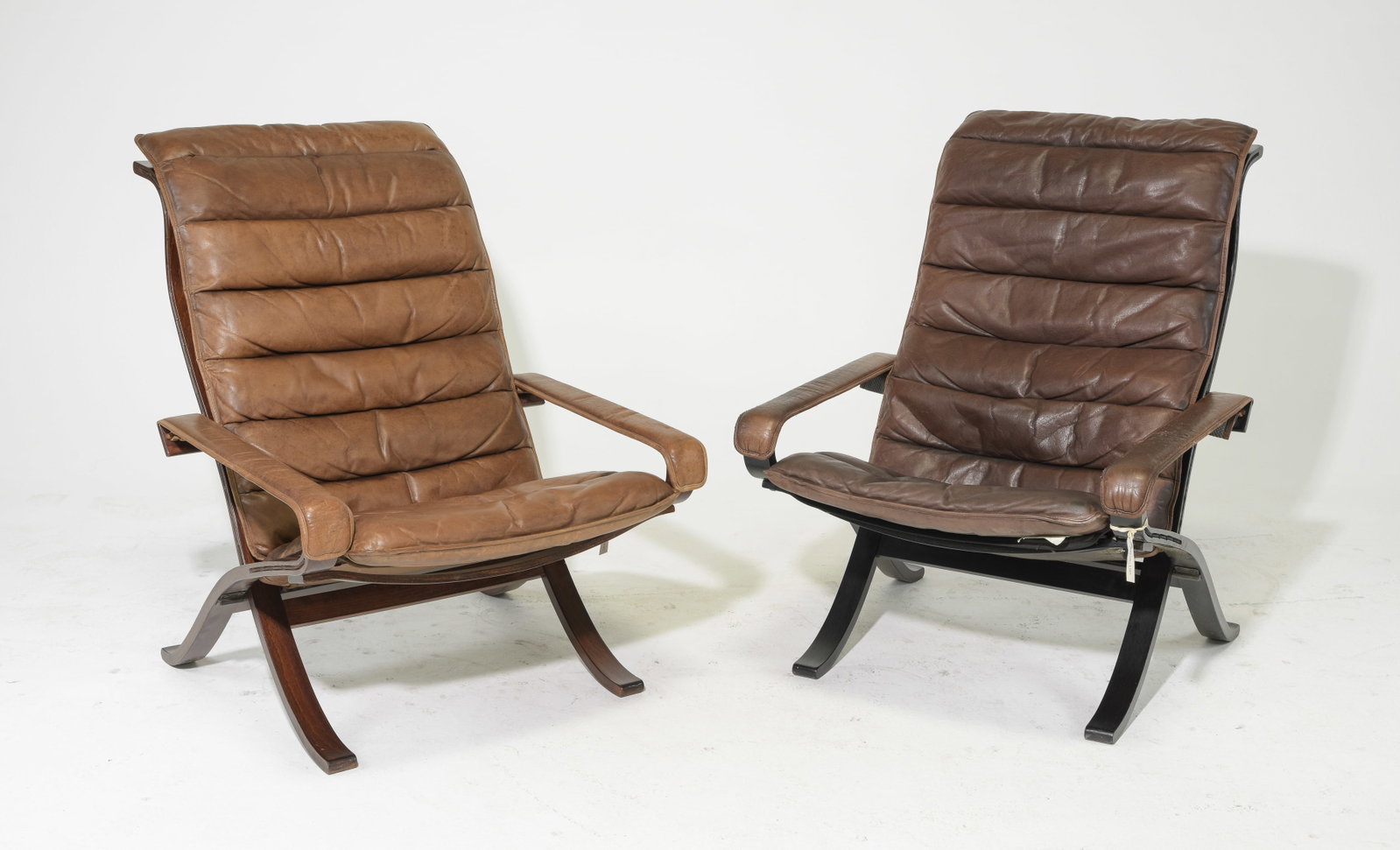 2 Danish Modern Brown Leather Lounge Chairs: 2 Danish Modern Brown Leather Lounge Chairs - 39 in tall x 29 x 35 each with a seat height of 17.5 inches