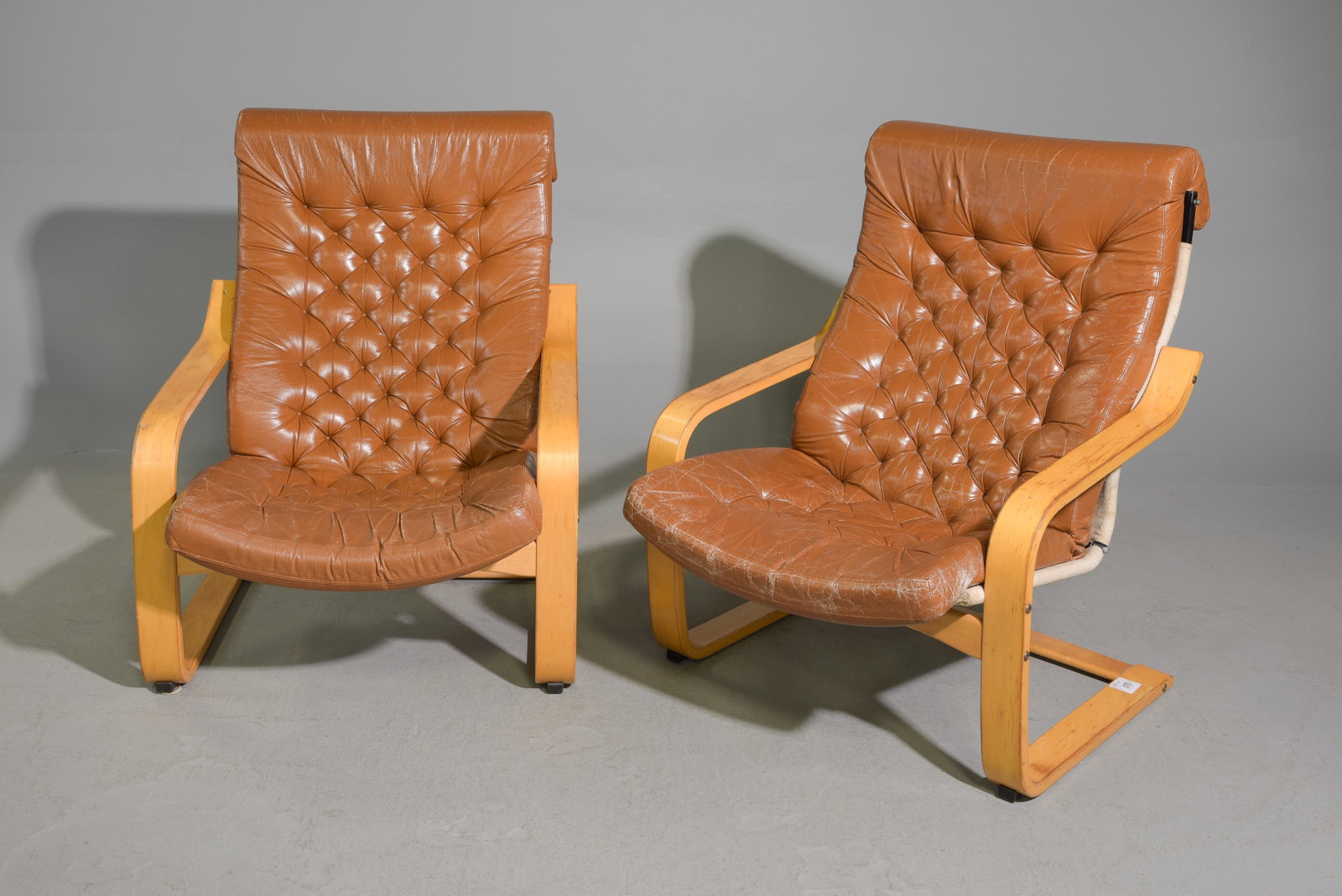Swedish Pair of Tufted Back Lounge Chairs: Scandinavian Pair of Tufted Back Leather Lounge Chairs - 38.5 in tall x 29.25 x 37.5 each with a seat height of 14 inches