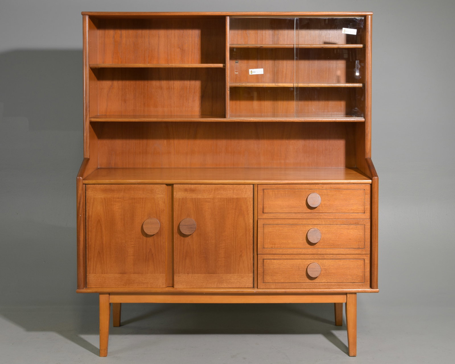 Mid Century Modern Cocktail Cabinet / Hutch: Danish Modern Style Cocktail Cabinet / Highboard featuring slanted circular pulls and sliding glass doors - 62 in tall x 64 x 18