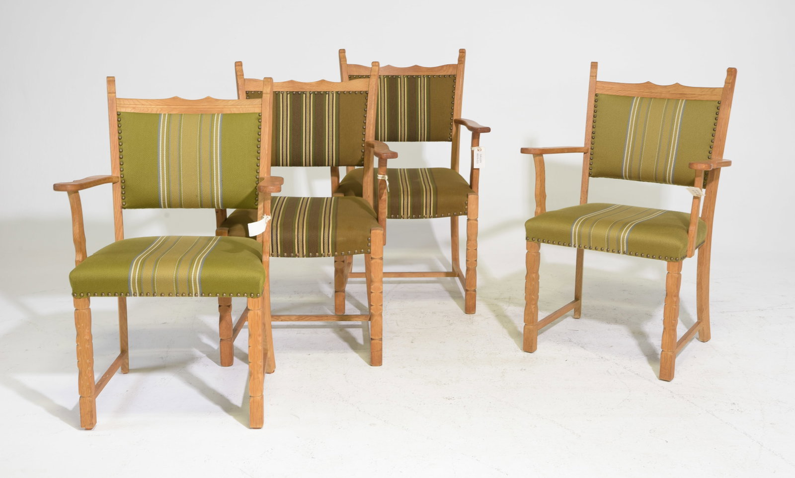 Four Danish Oak Green Upholstered Arm Chairs: Four Danish Oak Green Upholstered Arm Chairs - The lighter green upholstered ones are 37 in tall x 24.5 x 22 each with a seat height of 18.5 inches and The darker green ones are 36.5 in tall x 24 x