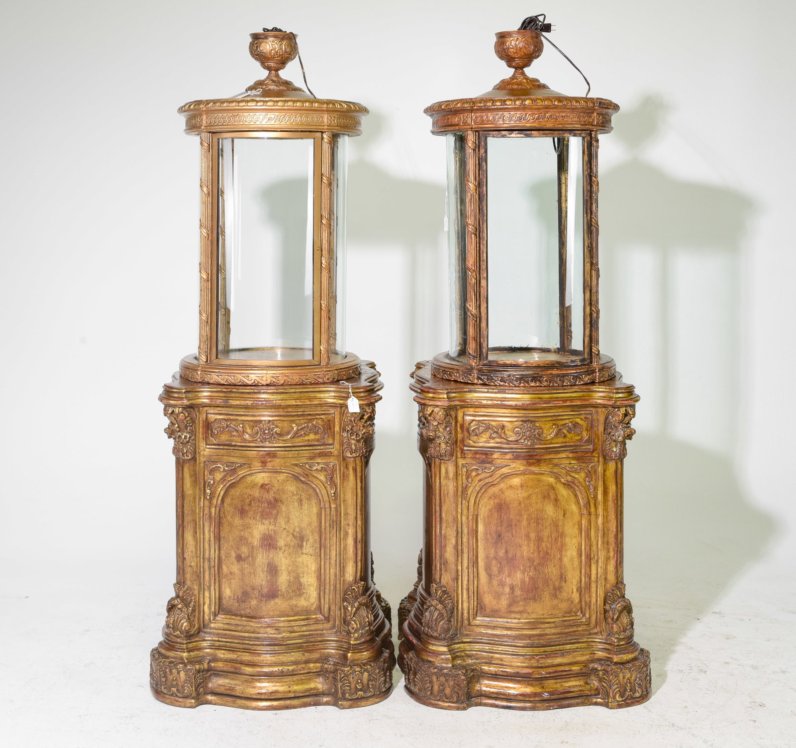 2 Antique Baroque Style Gilded Cylindrical Vitrines: 2 Antique French Rococo / Baroque Style Ornate Gilded Cylindrical Lighted Vitrines resting upon gilded Baroque shapely pedestals - 68.5 in tall x 28 x 28 each - These are in working condition