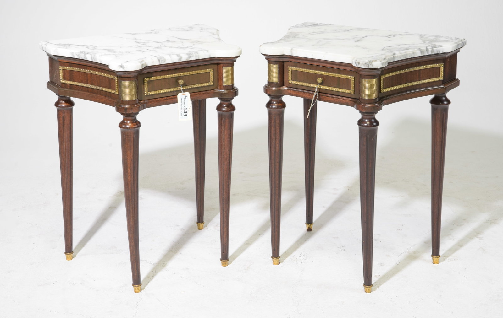Louis XVI Style Pair of White Marble Top Side Tables: French Louis XVI Style Pair of White Marble Top Mahogany Single Drawer Side Tables with gilded accent trimming and supported by tall tapered legs - 27.75 in tall x 20.75 x 15