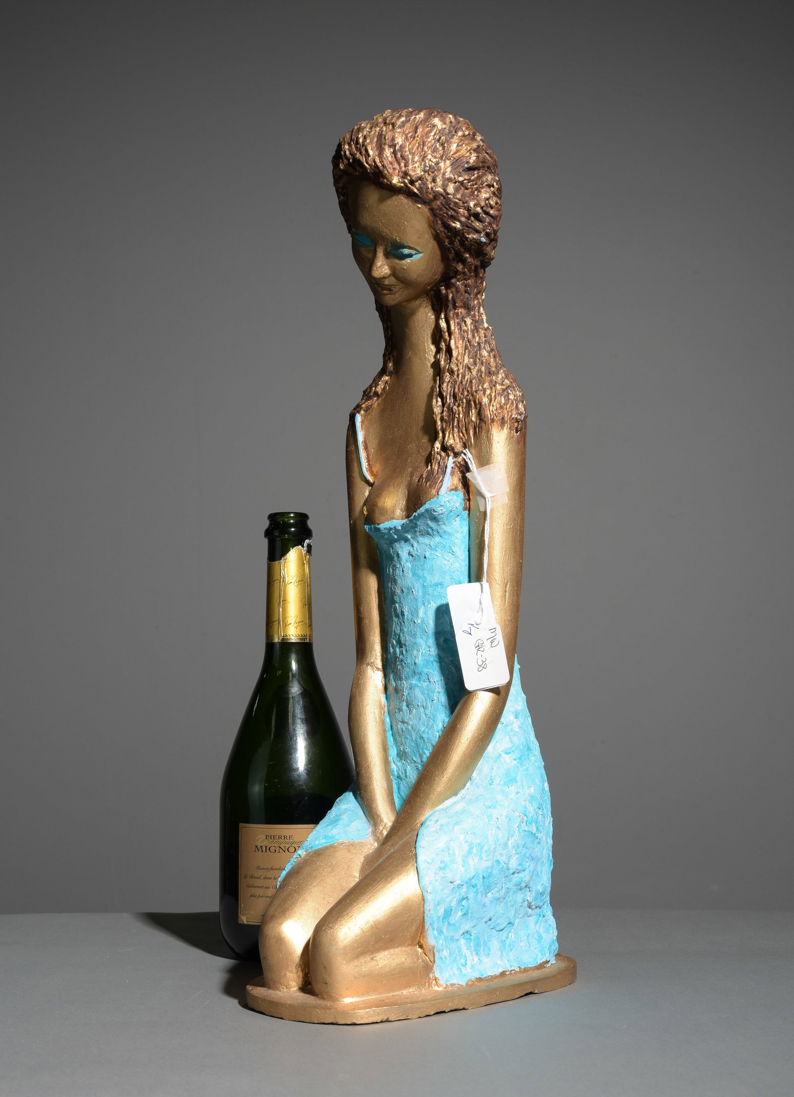 "Dreaming Girl" Bronze Figure by Prince Monyo: This modernist gilded and painted bronze sculpture figure is titled "Dreaming Girl" crafted by Prince Monyo. The Prince is an acclaimed Romanian-American sculptor known for his stylized, elongated