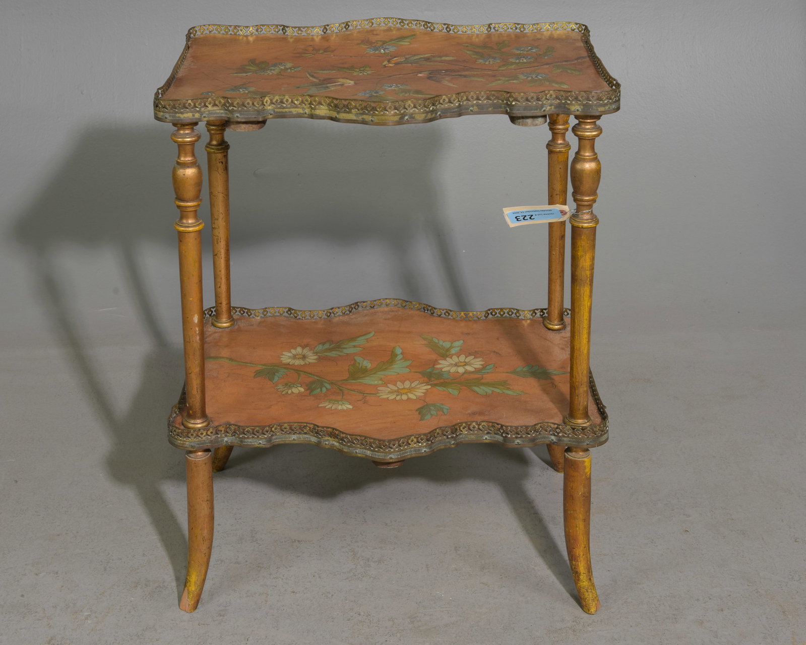 Art Nouveau Style Two-Tiered Table with Floral Motif: Art Nouveau Style Two-Tiered Table with Floral Motif and Brass Gallery - 29 in tall x 22.5 x 14
