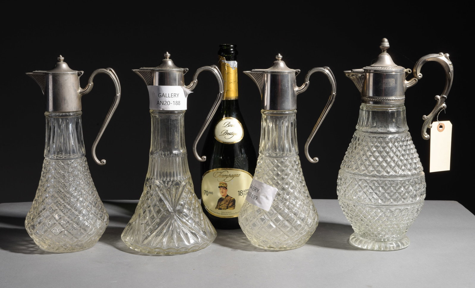 Four Assorted Cut Glass Silver Capped Claret Jugs #1 (1 of 8)
