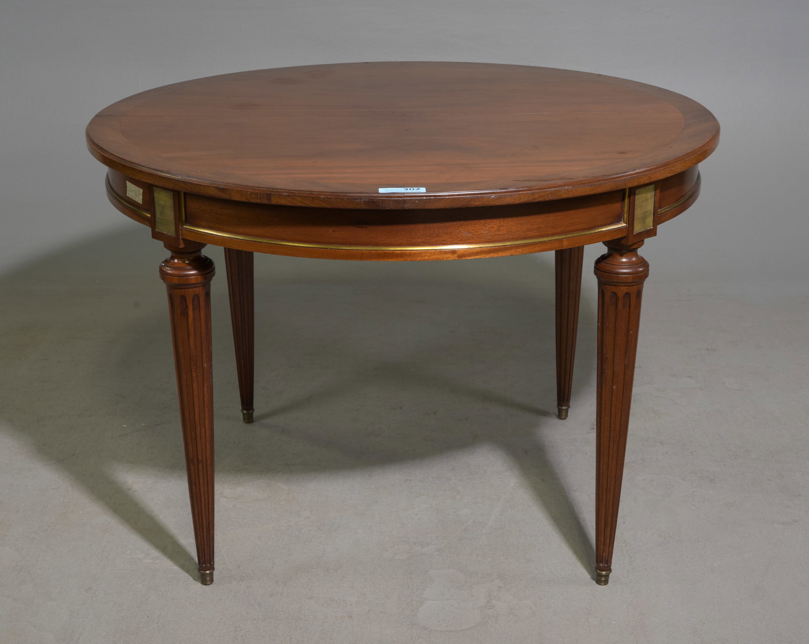 Louis XVI Style Mahogany Round Table: French Louis XVI Style Mahogany Round Table supported by fluted tapered legs - 29 in tall x 43 inch diameter, floor to apron is 24.75 inches and the space between the legs is 24 inches