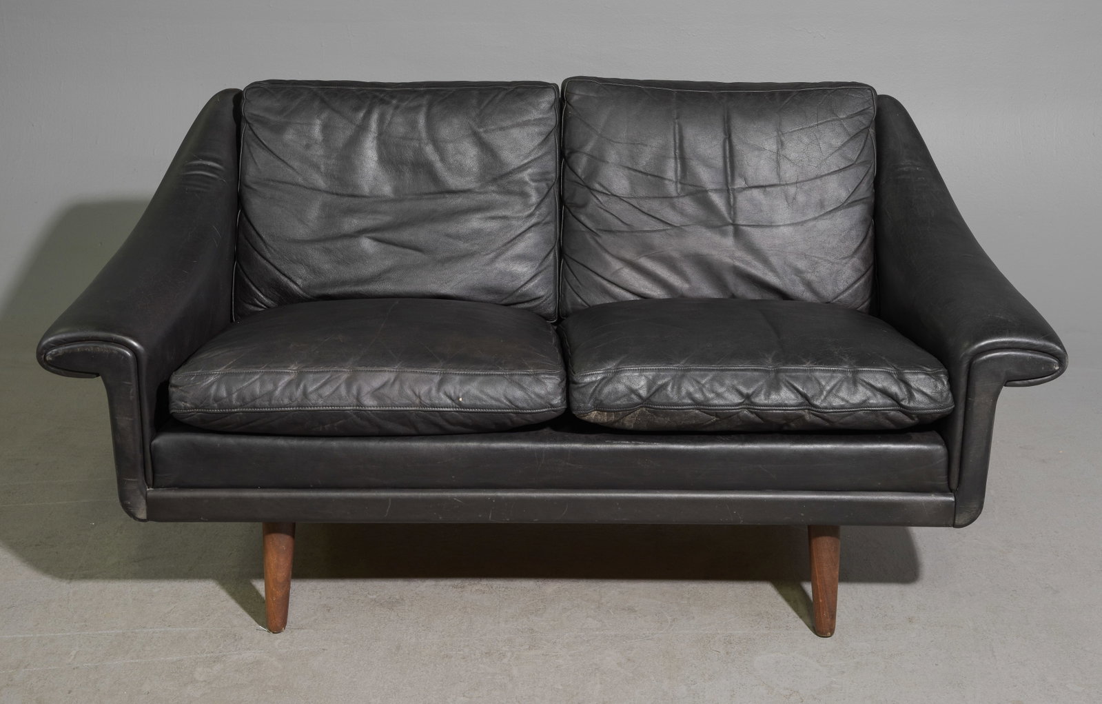 Danish Modern Matador by Aage Christiansen: Danish Mid Century Modern Two Seater Sofa / Loveseat for Matador by Aage Christiansen in Black Leather - 29 in tall x 57.5 x 32 with a seat height of 17.5 inches