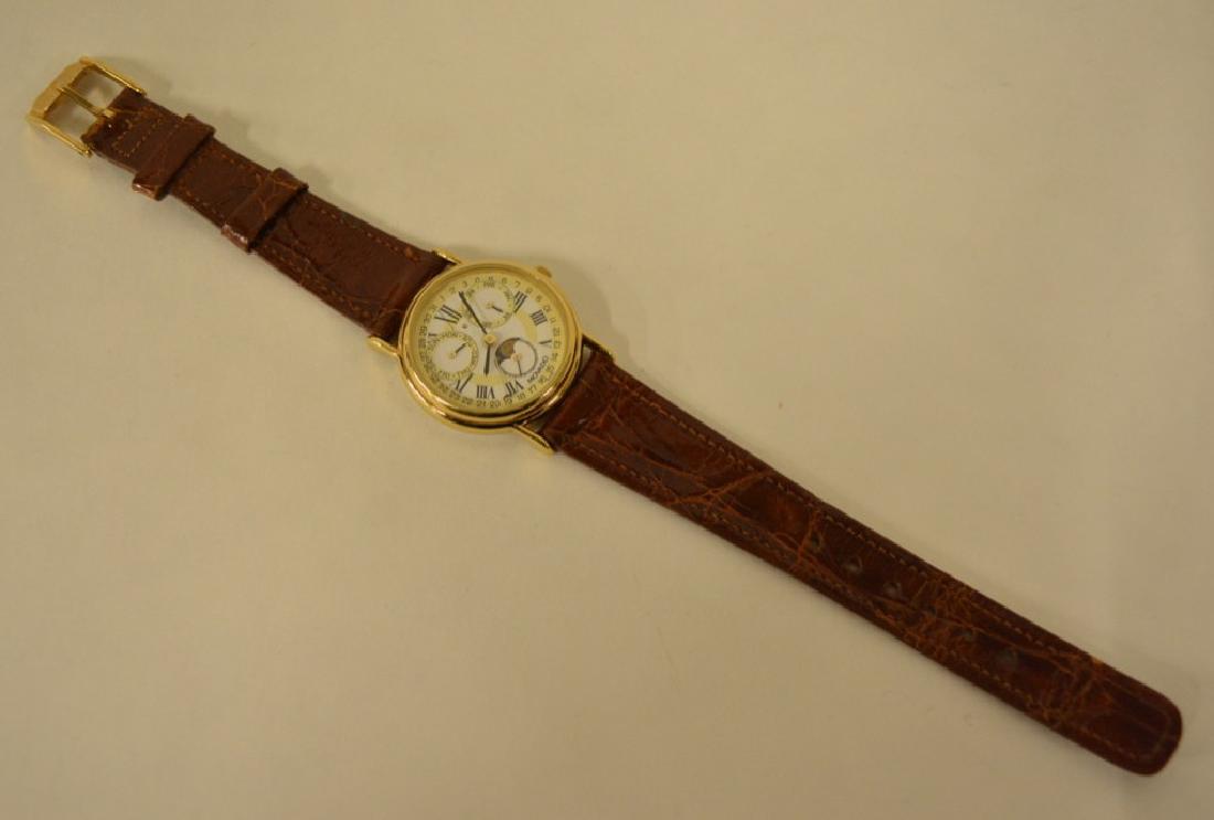 Movado Moonphase Chronograph Watch: Very nice watch #87-03-822. The triple function chronograph has the original ESQ alligator band. Measures 1-1/8" in diameter and is in very nice condition with light use.