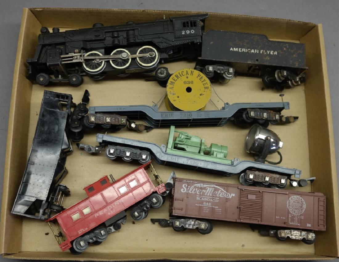 American Flyer 290 Engine, Cable, Searchlight Car: 290 engine with tender (rusty surface wear), Erie 7210 cable transport, Erie 7210 with searchlight, Silver Meteor box car, 632 black coal car, 630 caboose.