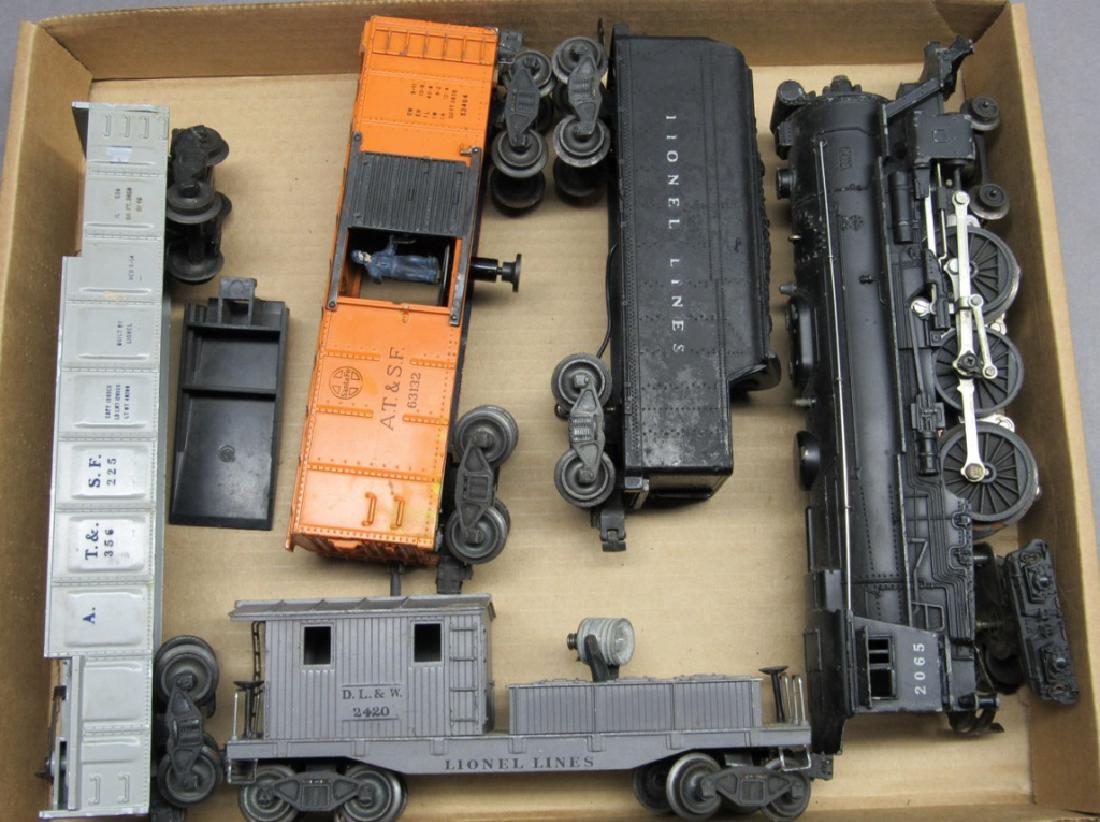 Lionel 2065 Engine w/tender/63162/356225/Caboose: Engine has some moderate usage wear. 63132 Box Car. 356225 Barrel Gondola Car. 2420 Workmans Caboose.