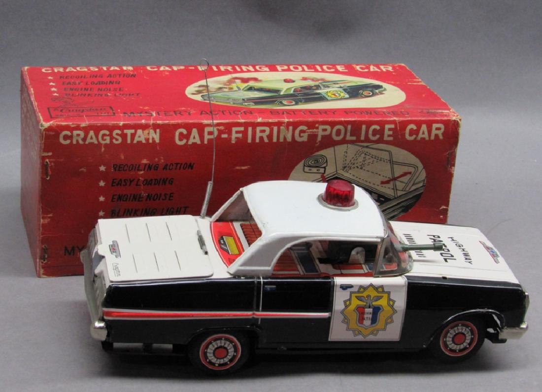 Cragstain Cap Firing Police Car in box: Battery operated, top of car has been removed, untested, box is in good condition.