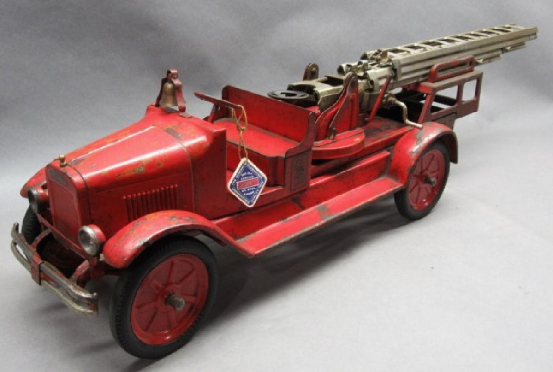 Buddy L CFD Aerial Ladder Truck-Headlight -Origina: Original water decals are dirty, bell and ladders are original, rubber tires, bumper and rare headlight version (non-lighted), paint wear and rust, good original paint. Out of the Hankins collection.
