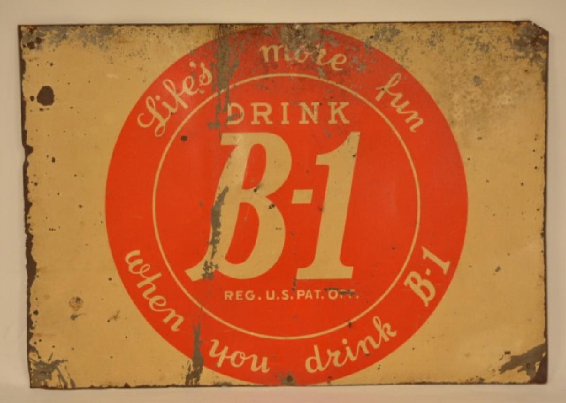 SST Drink B-1 Soda Advertising Sign: Fair condition SST Drink B-1 Advertising Sign with wear, rust, some bends, and paint loss. Sign measures 14" tall x 20" across.