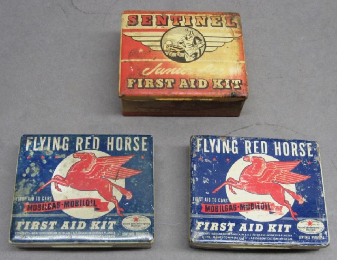 Lot of 2 Mobil Flying Red Horse first aid tins +: 2 flying red horse first aid tins (empty). Lot includes a Sentinel Junior Ace first aid kit with some contents.