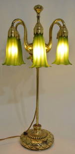 Tiffany Studios Brass 6-Light "Lily" Lamp #1064: Nice signed Tiffany Studios brass adjustable 6-light "Lily" desk lamp. The lamp is #1064 and has been rewired. The lamp comes with 5 reproduction shades. The lamp is in very nice condition and