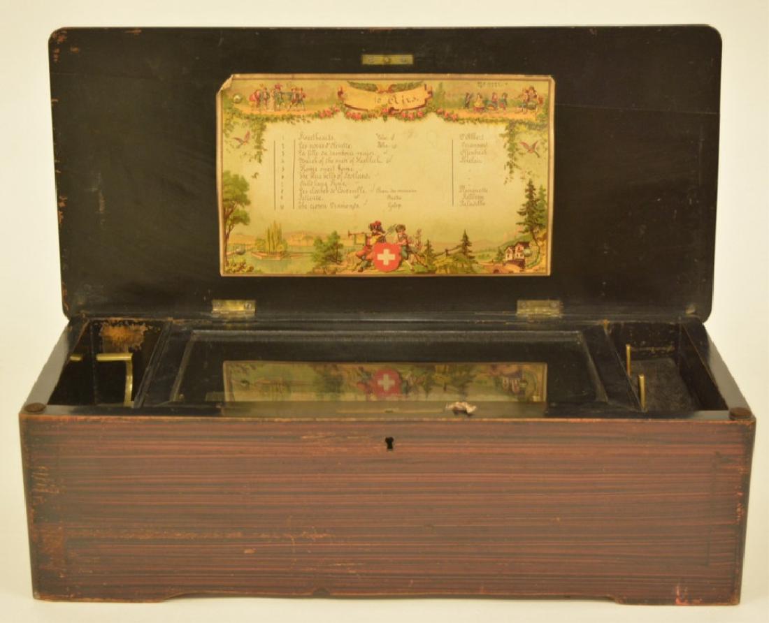 Antique Swiss Music Box-10 Airs: Box is in very good physical condition with an inlaid lid. It works on & off and will need a cleaning and adjustments by the new owner. Includes the song list on the inside of the lid. Measures 18" x