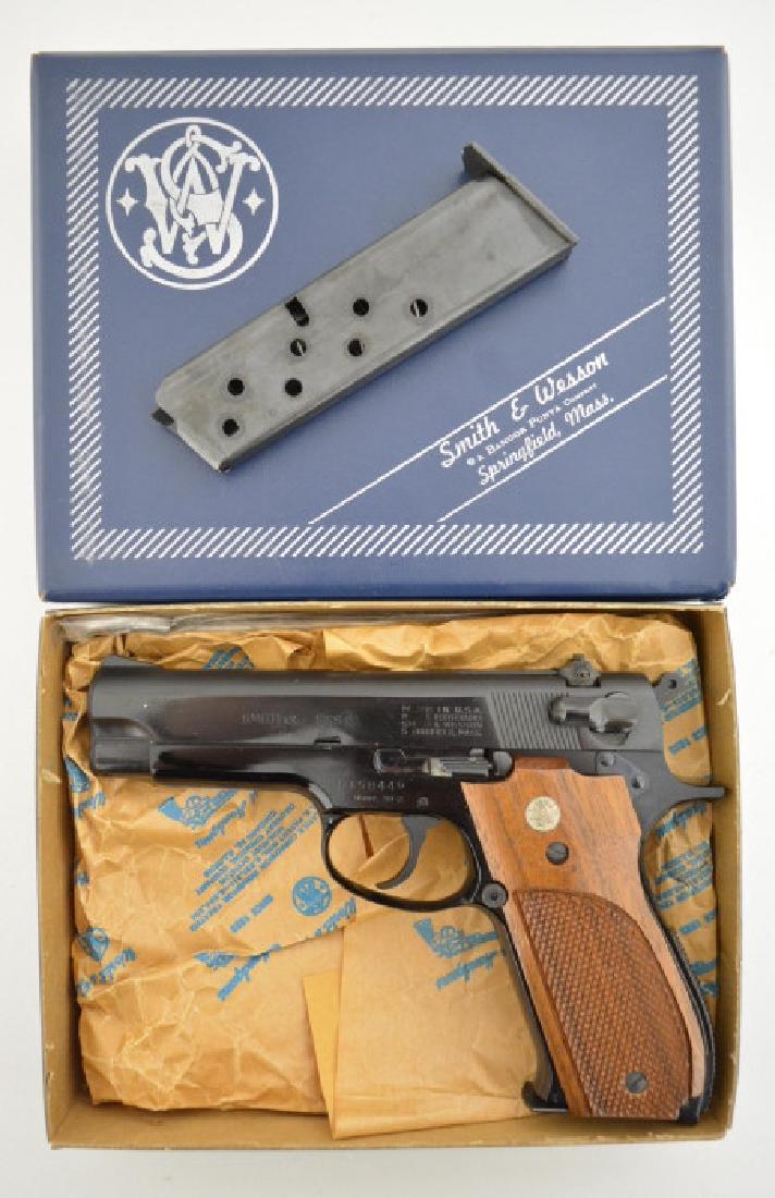 Smith & Wesson Model 39-2 9mm Semi-Auto Pistol MIB: Gun is unfired in the original box with original paperwork and tool. The 9mm pistol has a 4" barrel, blue finish, two mags, and is Model 39-2. SN: A158446. FFL required for transfer.