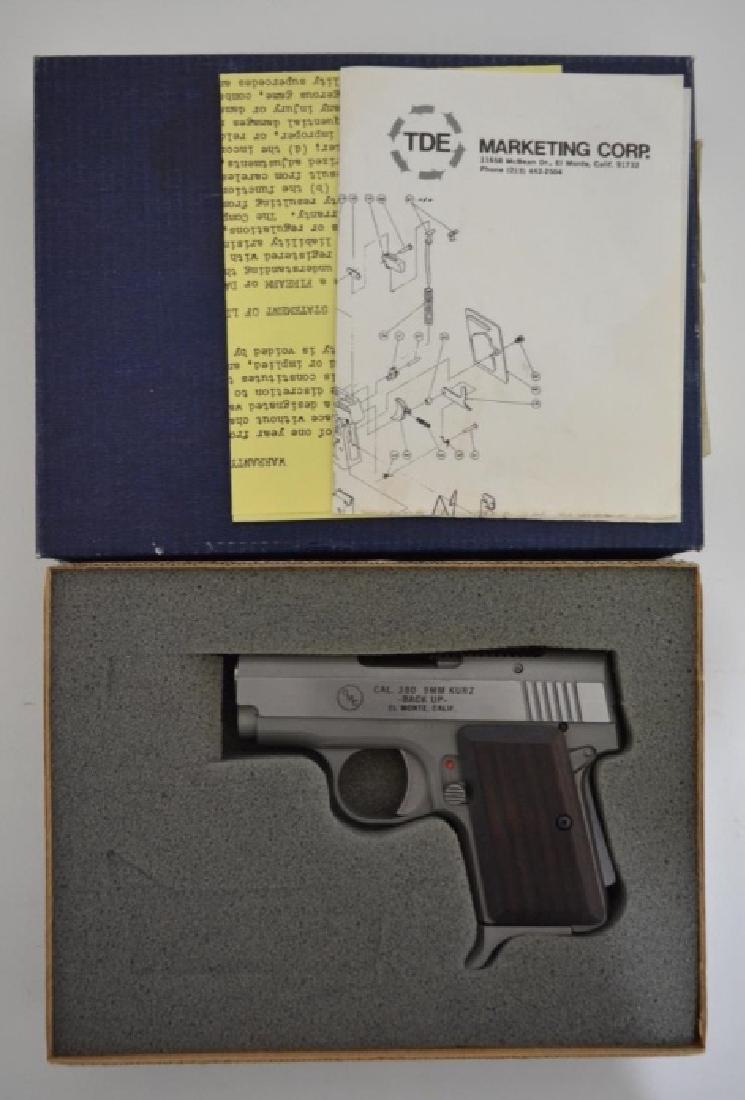 OMC Backup .380 Cal. Semi-Auto Pistol MIB: Gun is unfired in the original box with original paperwork. The .380 cal. pistol has a 2.5 barrel, stainless steel, and is Model Backup. SN: E01256. FFL required for transfer.