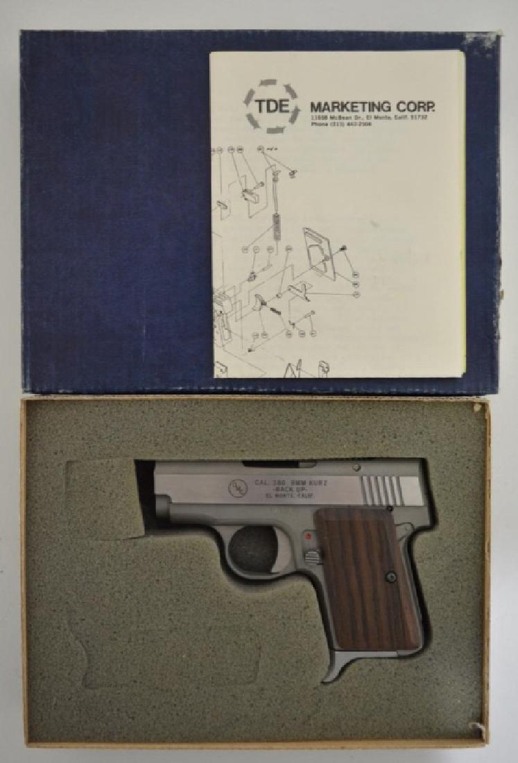 OMC Backup .380 Cal. Semi-Auto Pistol MIB: Gun is unfired in the original box with original paperwork. The .380 cal. pistol has a 2.5 barrel, stainless steel, and is Model Backup. SN: E02017. FFL required for transfer.