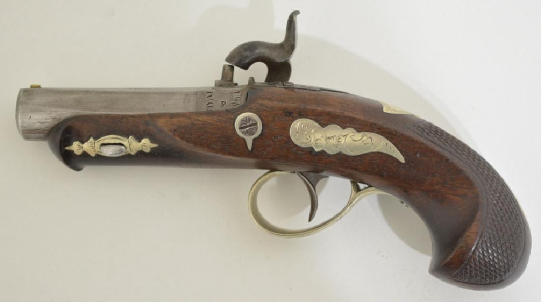 1866 J. Derringer Percussion Pistol: Caliber: .41 percussion, German engraved silver. This gun was made for A.J. Plate/ San Francisco. Barrel is 2" in length. Bore is in fine condition and the firing mechanism is excellent. Stock is chec