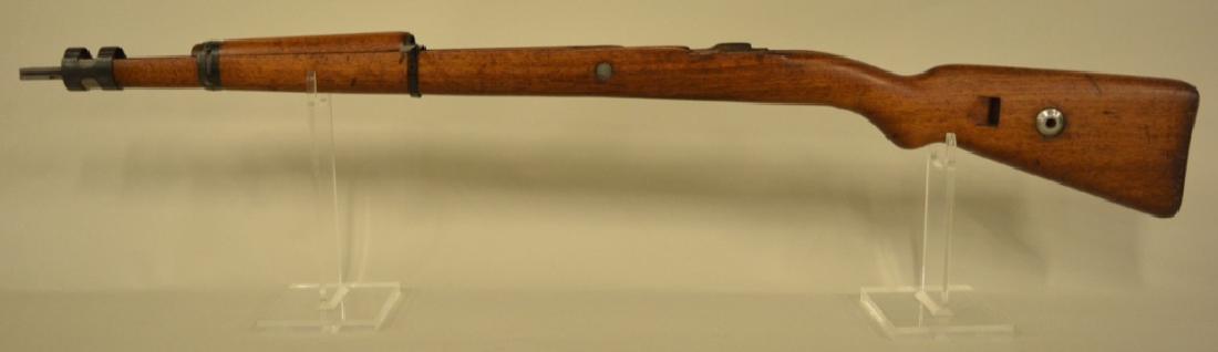 German WWII K98 Mauser Stock: Nice condition hardwood German WWII K98 Mauser Stock. The stock channel is marked 6389, the butt plate is marked 61930. Stock measures 40" long.