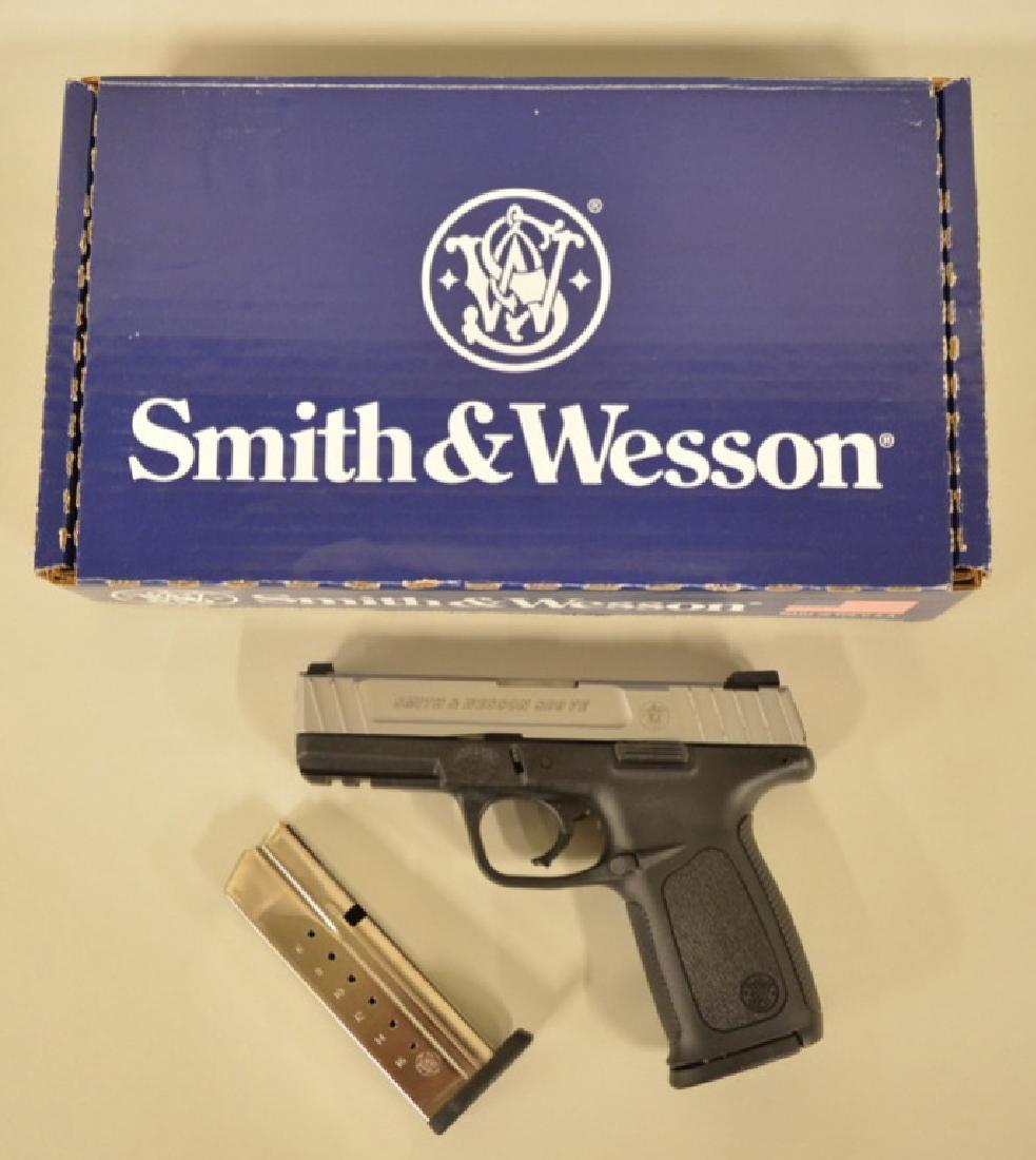 Smith and Wesson SD9 VE 9mm Pistol: Gun includes original box, paperwork, gun lock, and two magazines. Overall excellent condition but could use a cleaning as there is dirt appearing on it. SN: FWF6450. FFL is required for transfer.
