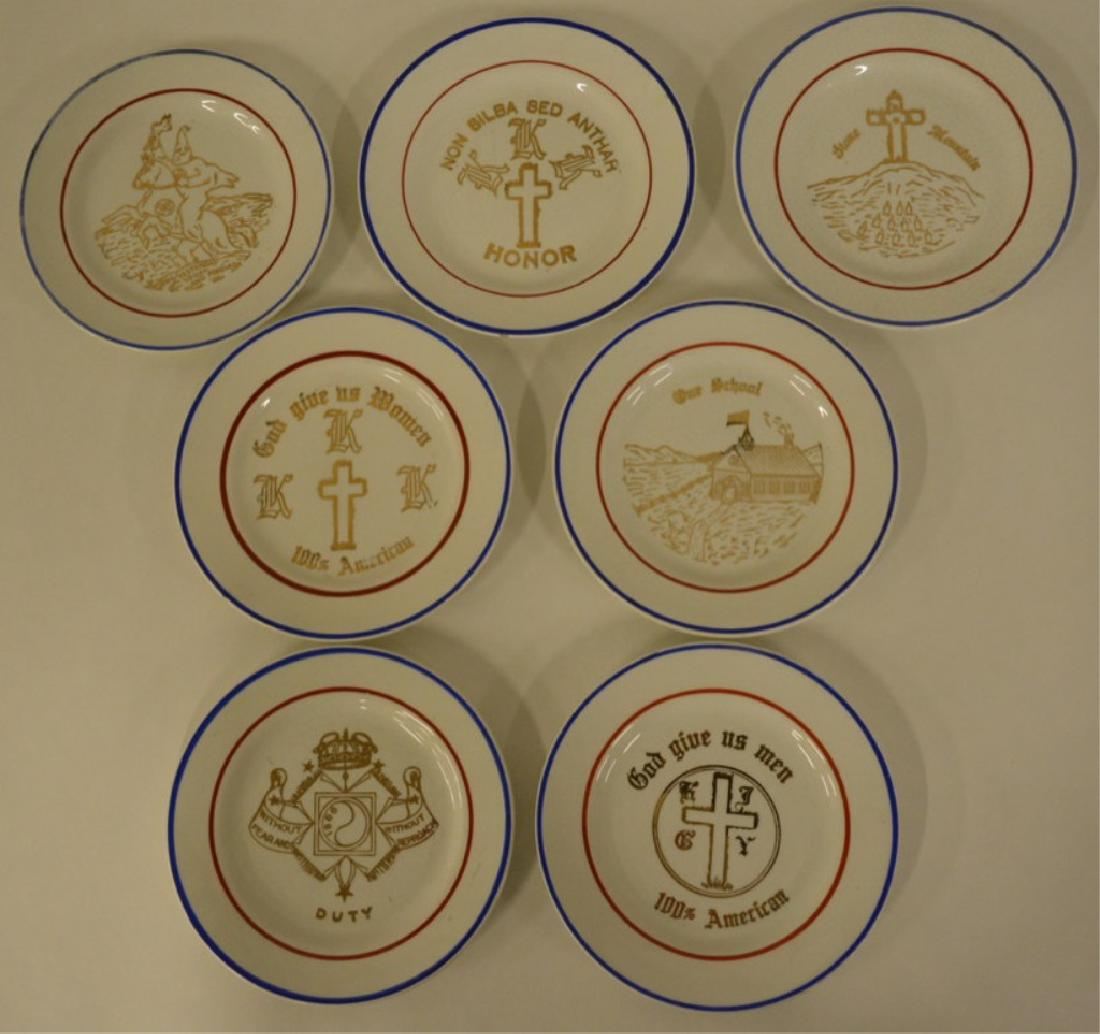 Vintage Gold Gilt KKK Plate Lot Of 7: Nice lot of 7 vintage Ku Klux Klan gold gilt plates. All seven plates have different gold gilt scenes and phrases. Plates were stamped and decorated by A.C. Blair Klanplate Co. They are all in nice co