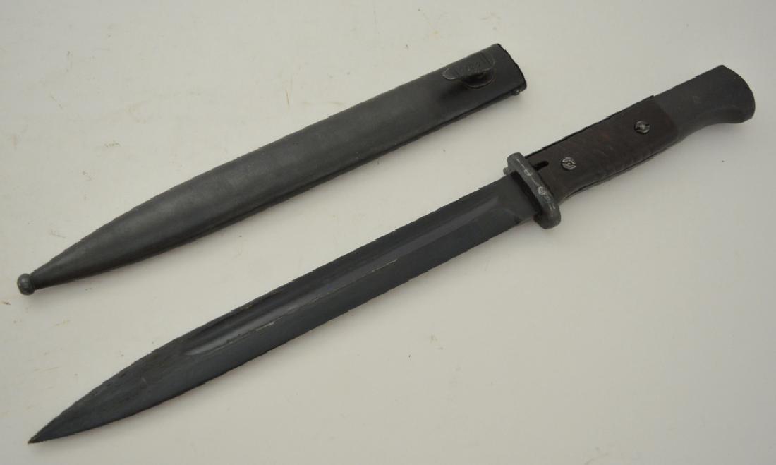 WWII German K98 Mauser Bayonet & Scabbard: Nice German K98 bayonet for a Mauser rifle. Bayonet comes with metal scabbard with matching serial numbers 7432. Blade measures 10" long, overall with scabbard 16" long.