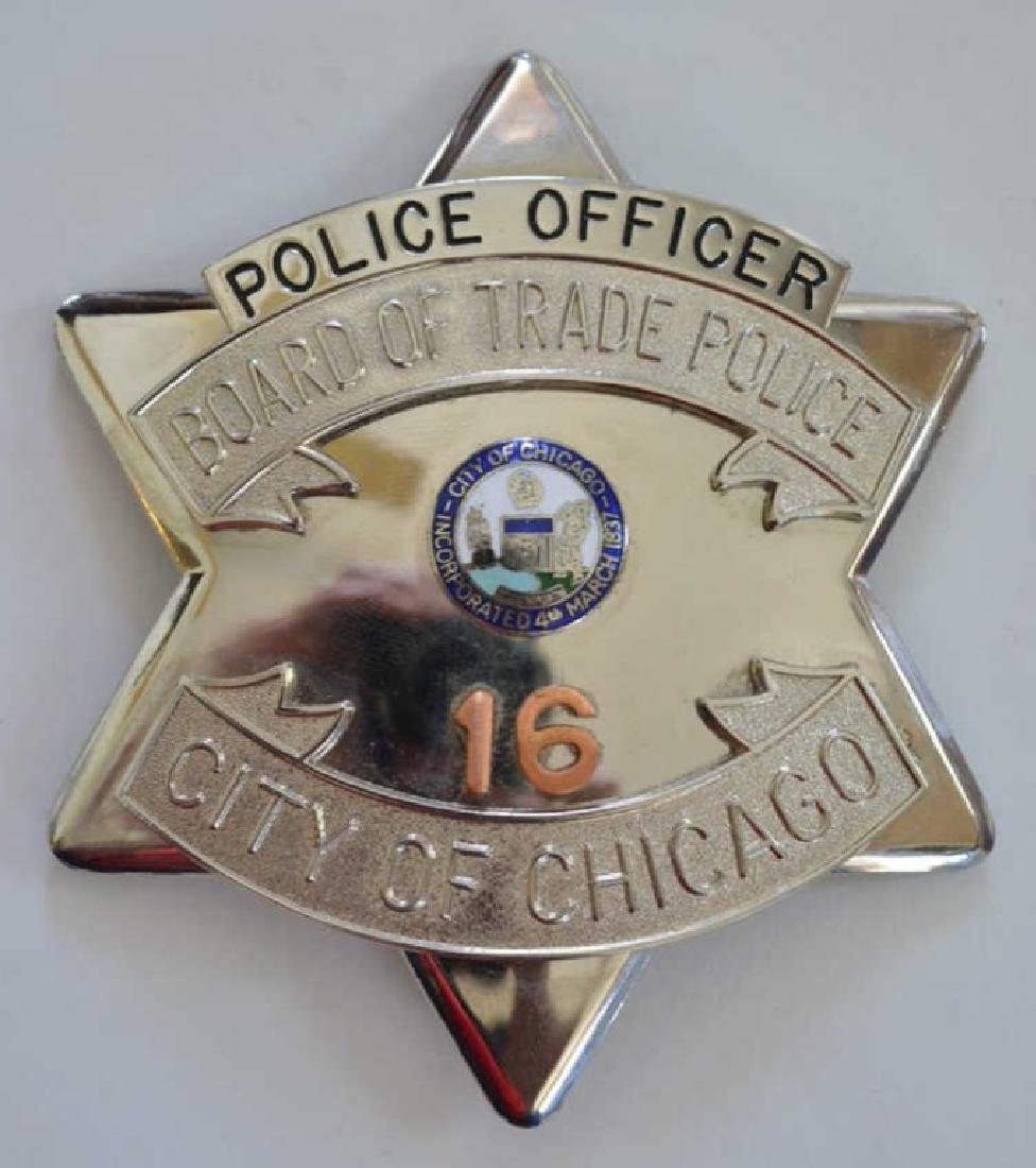 Obsolete Chicago Board Of Trade Pie Plate Badge: Nice Chicago Board Of Trade Police Officer pie plate badge #16. This badge was made by Blackinton. The badge is in nice condition with the pinback, number "16" is made of copper. Measures approx 3-1/2